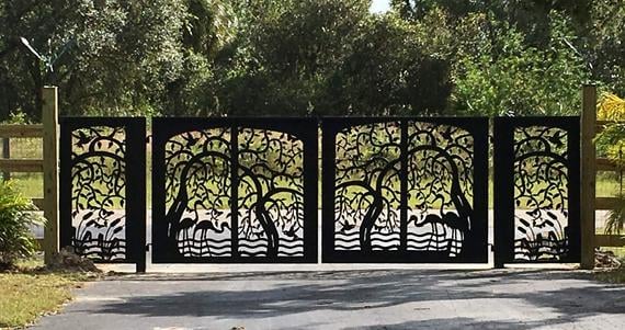 Metal gate with square tubes and decorative scrolls